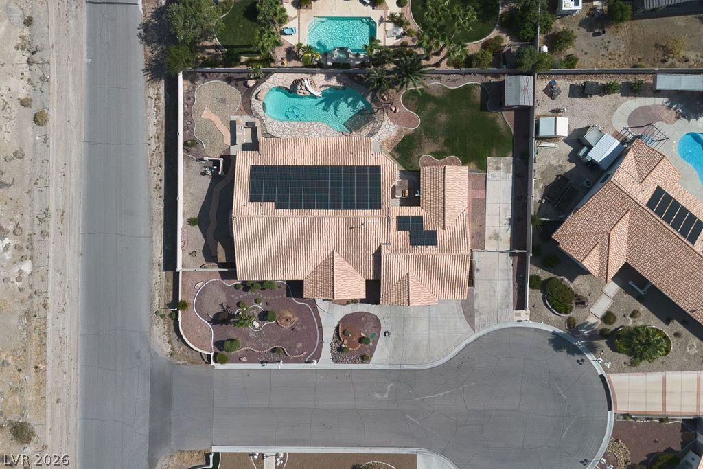 Image 2: An aerial perspective reveals a private pool with