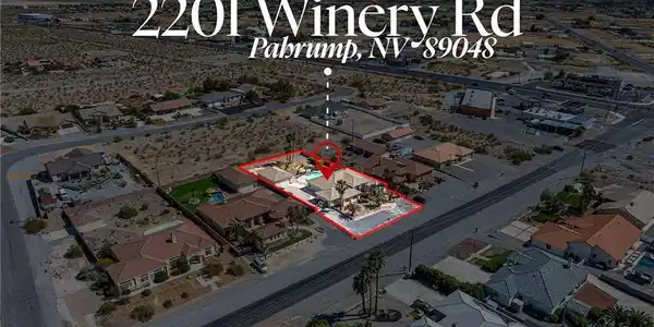 Image 2: An aerial perspective showcases a desert property