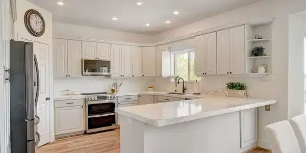 Image 3: Culinary creativity awaits in this bright kitchen,
