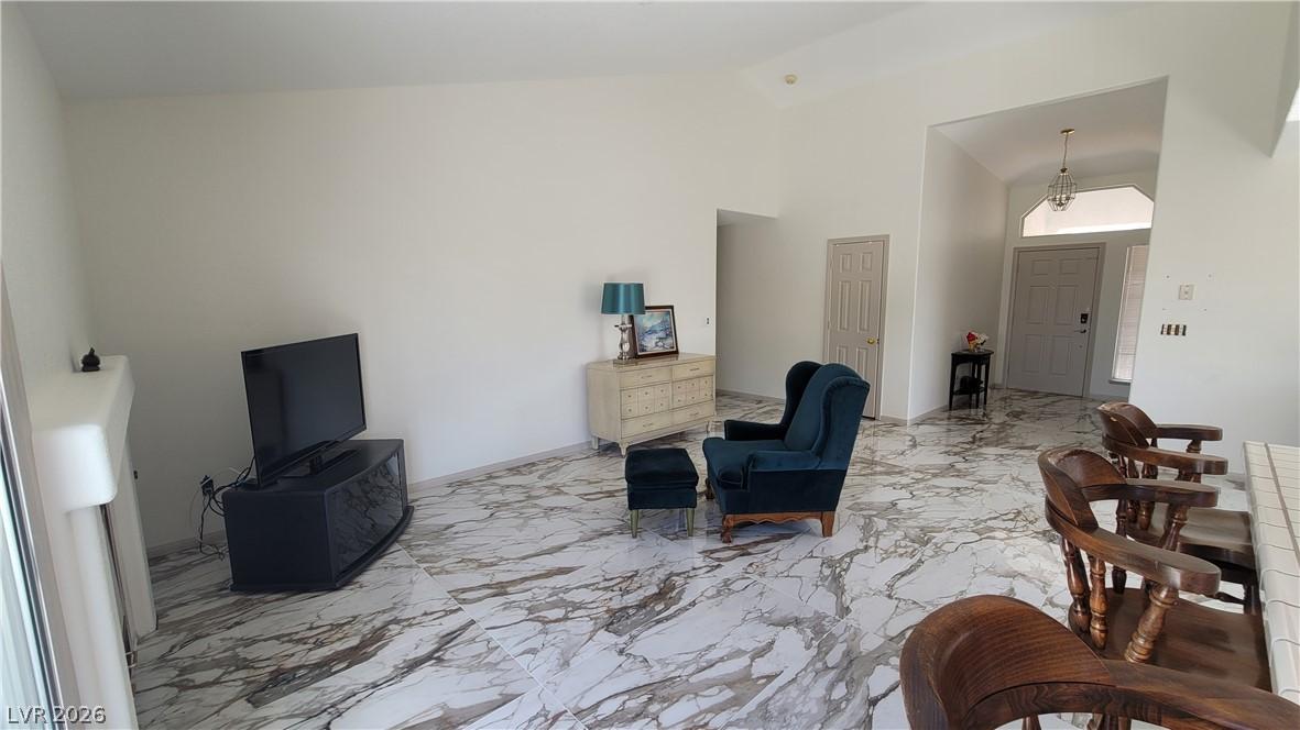 Image 4: Voluminous ceilings elevate this living area featu