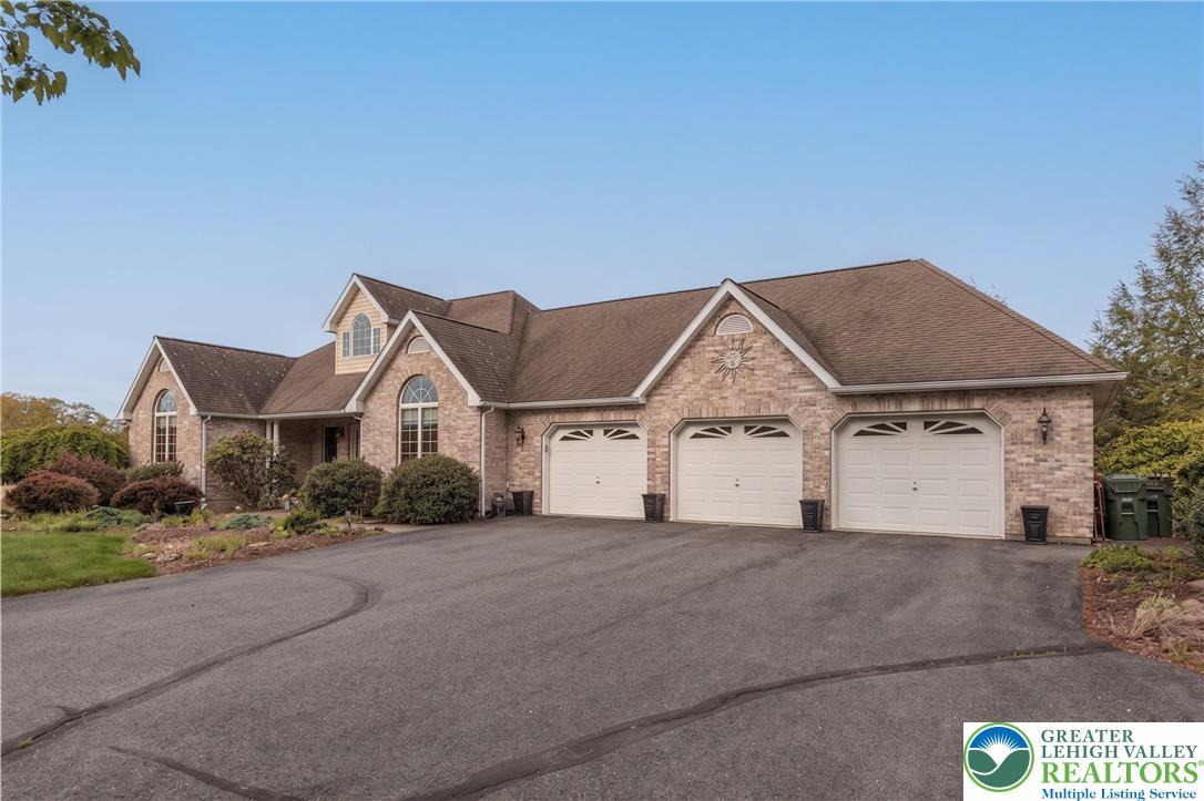 Image 4: This charming home offers ample parking with a lar