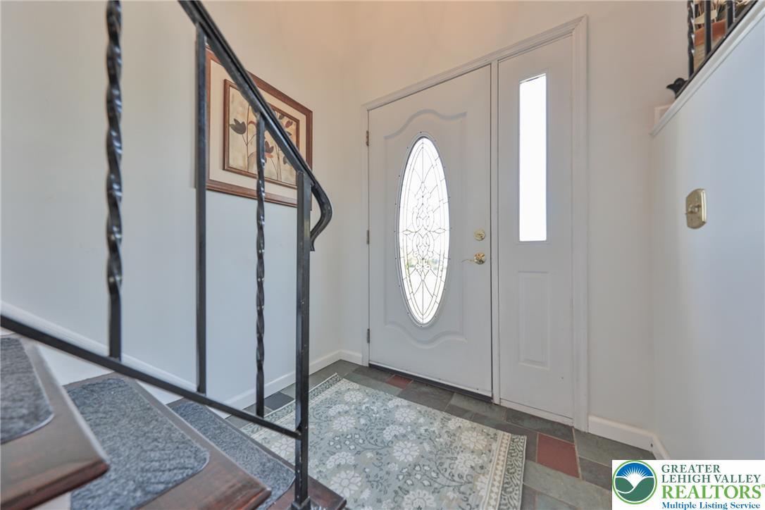 Image 3: A graceful entry with decorative glass door welcom