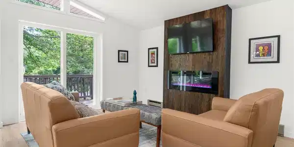 Image 4: A chic living space featuring a Linear electric fi