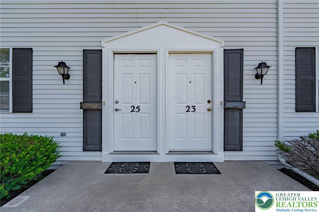 Image 4: Two welcoming entryways beckon, flanked by neatly