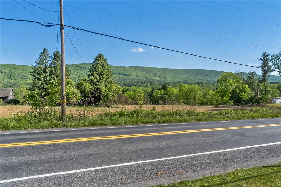 Image 4: Rolling green mountains provide a majestic backdro