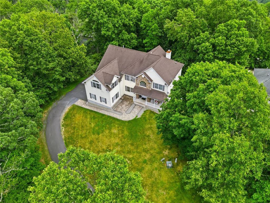 Image 2: Discover a charming residence nestled amidst a lus