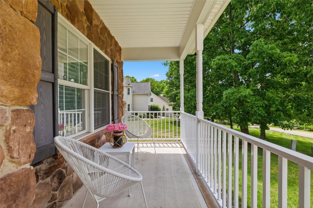 Image 4: Relax on the charming front porch, offering peacef