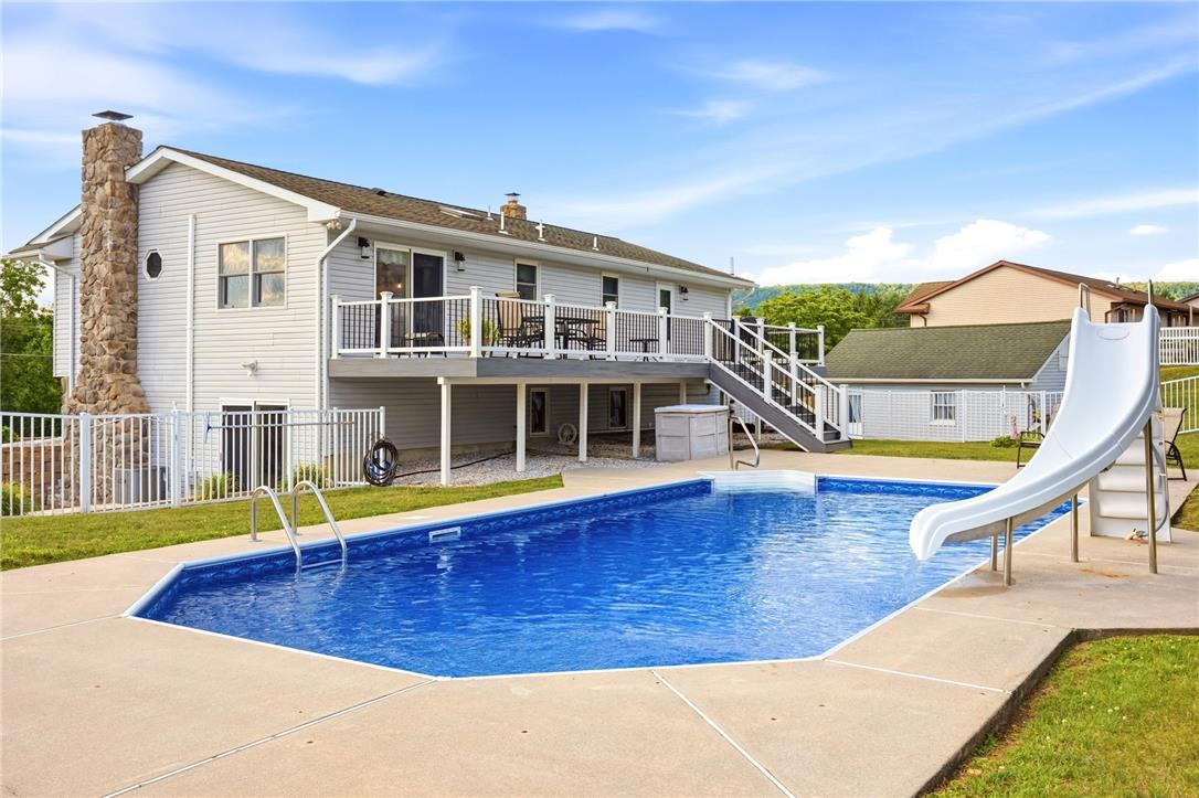 Image 3: An inviting backyard oasis awaits with a large, sp