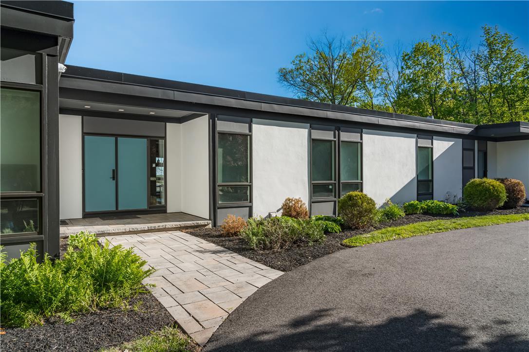 Image 3: A striking modern facade with clean lines welcomes