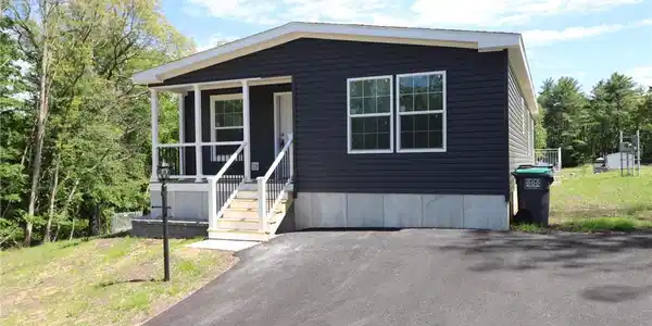 Image 4: A quaint residence featuring a welcoming porch and