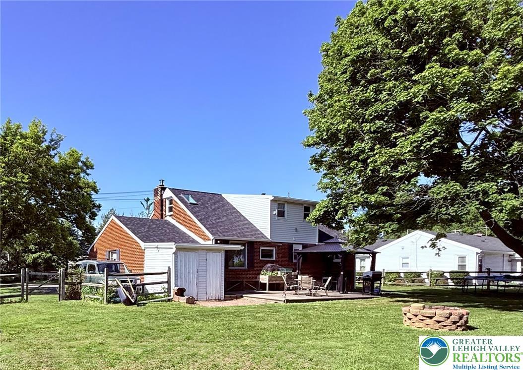 Image 3: A generously sized yard, complete with a private d