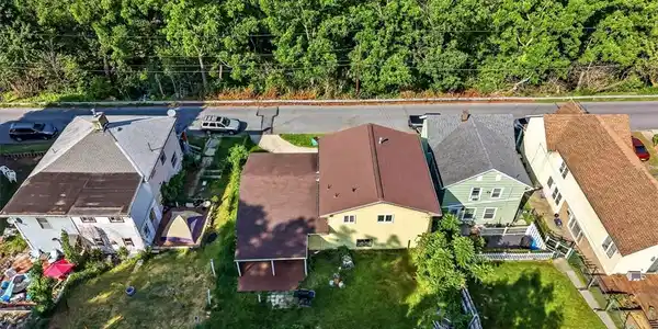 Image 3: An aerial perspective reveals several homes nestle