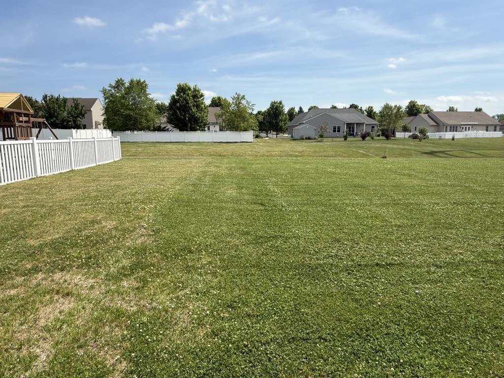 Image 2: A spacious backyard provides ample room for outdoo