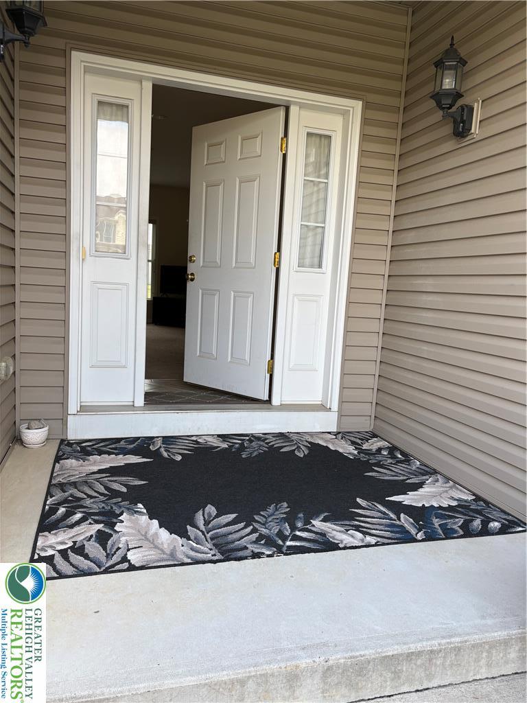Image 3: A large covered front entry allows for chatting wi
