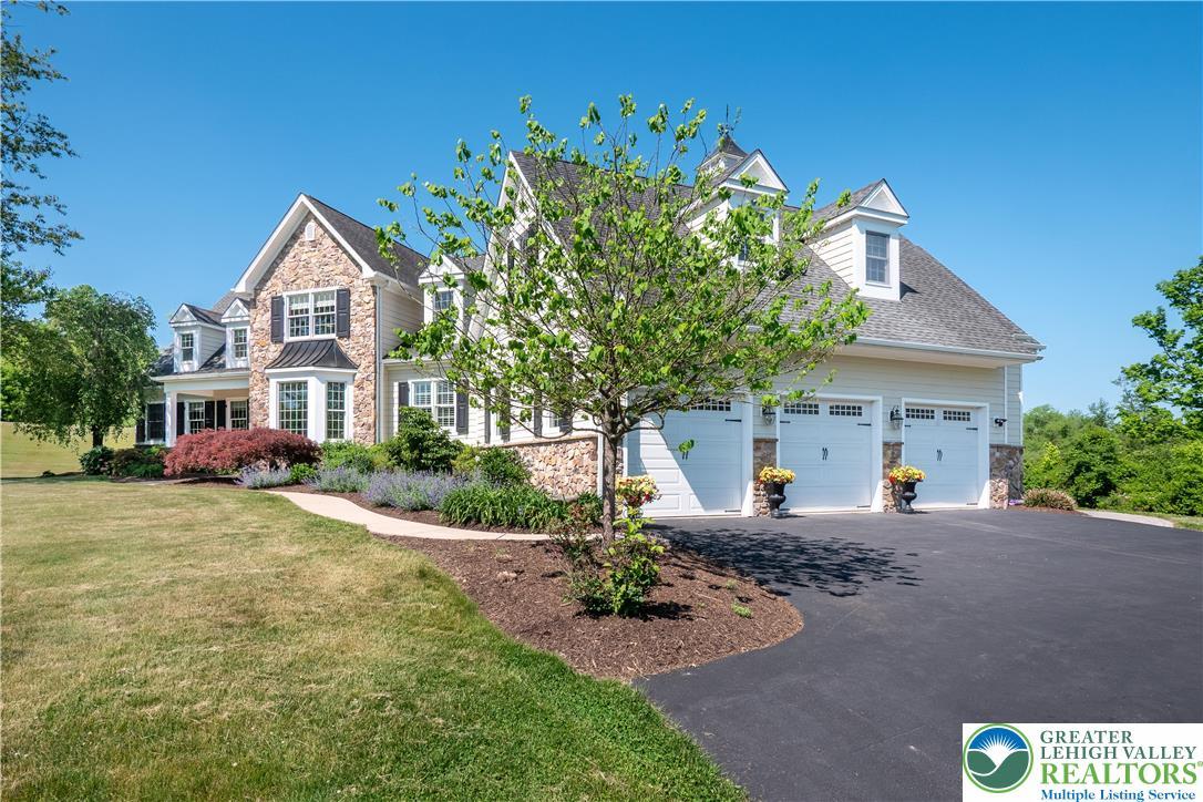Image 3: A well-maintained lawn and manicured landscaping c