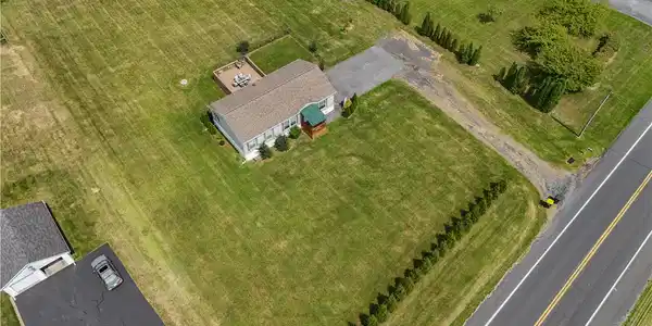 Image 4: An aerial perspective reveals a cozy home set with