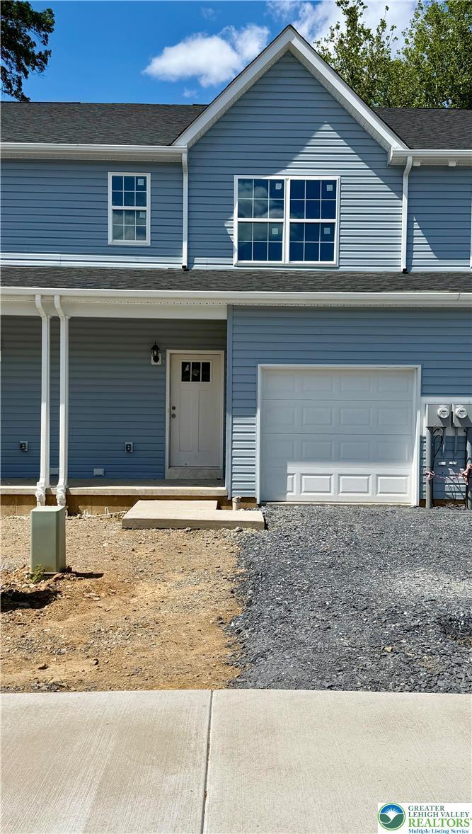 Image 1: A newly constructed residence features light blue
