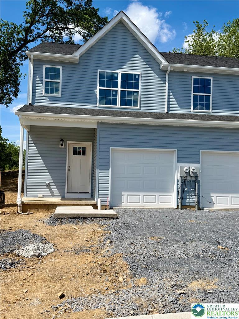 Image 1: A newly constructed residence featuring a clean fa