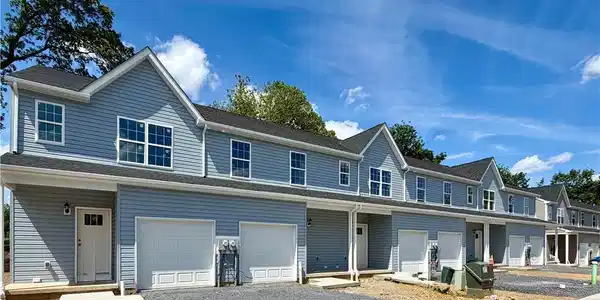 Image 2: Newly constructed townhomes present a clean, moder