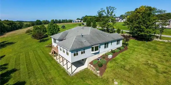 Image 4: Rolling green hills surround this hillside estate