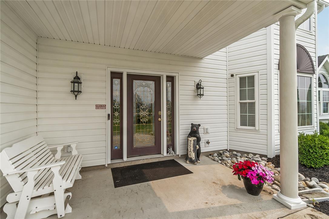 Image 3: A welcoming covered front entry beckons with a dec