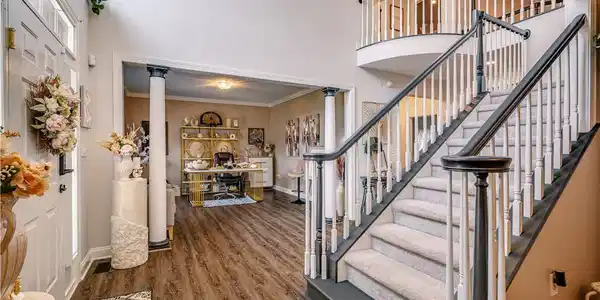 Image 4: A grand entrance welcomes with a dual-sided stairc