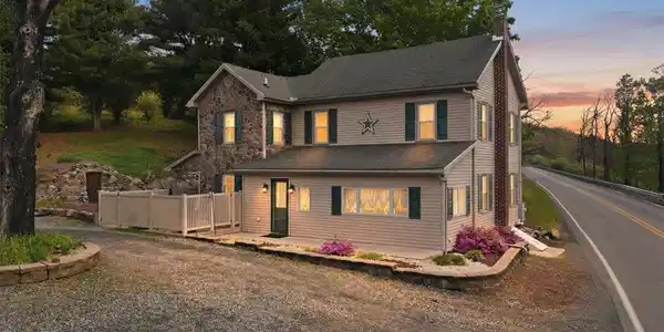 Image 2: This charming home offers a perfect blend of natur