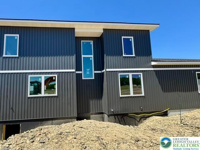 Image 3: Bold exterior architecture features durable metal