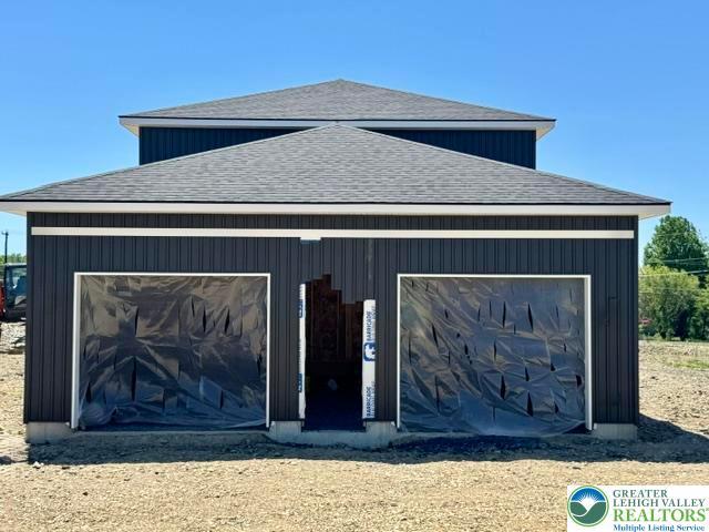 Image 4: A new construction home with two garage door openi