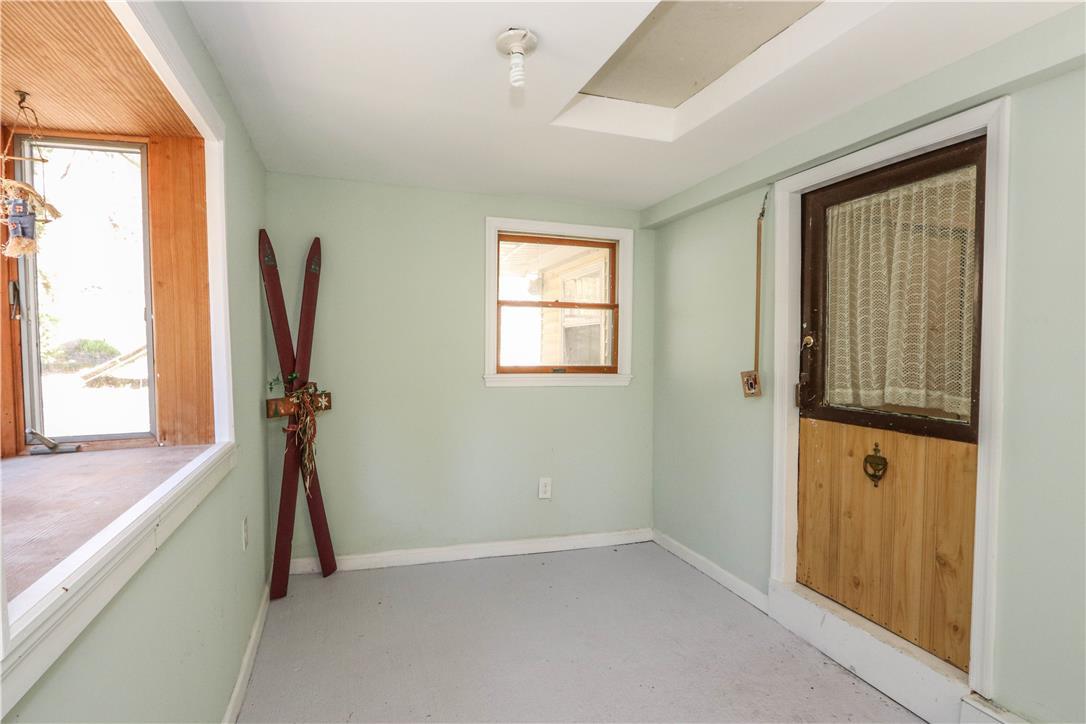 Image 3: A quaint entry area features a charming half-wood