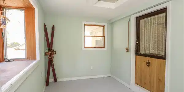 Image 3: A quaint entry area features a charming half-wood