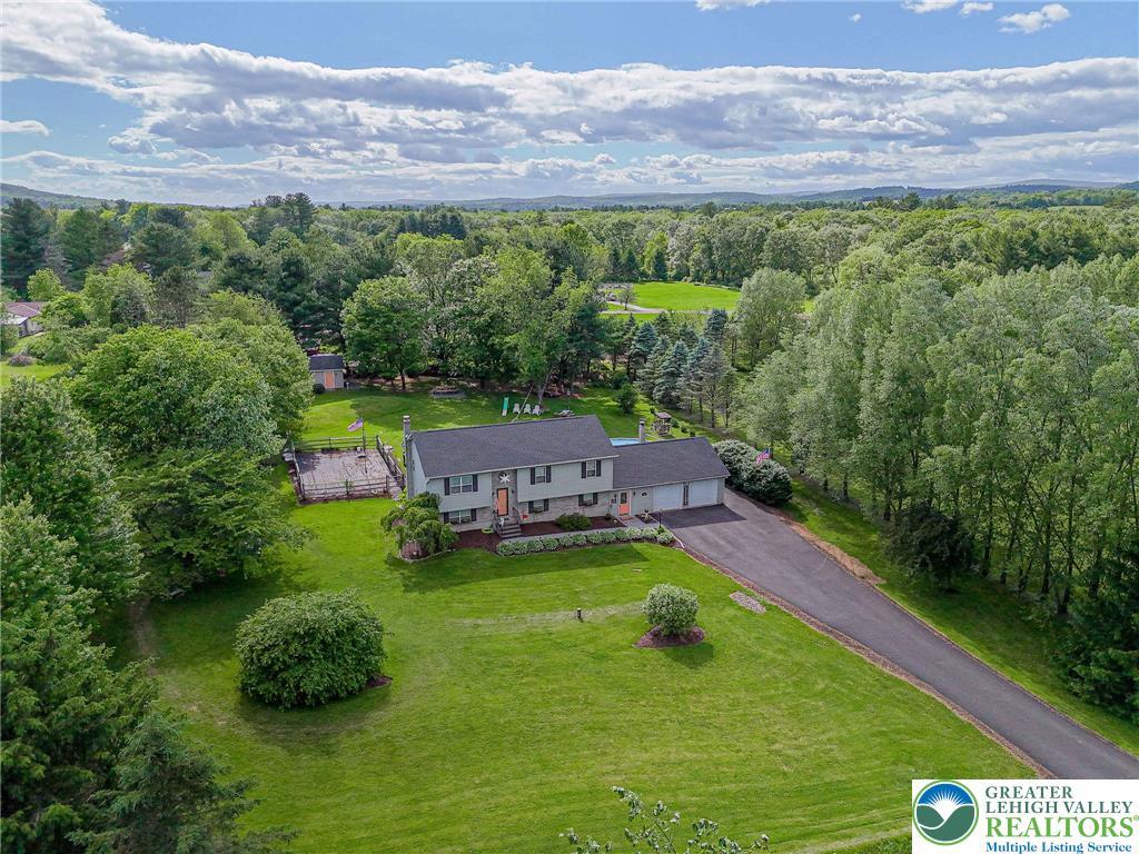 Image 4: An aerial perspective reveals a charming residence