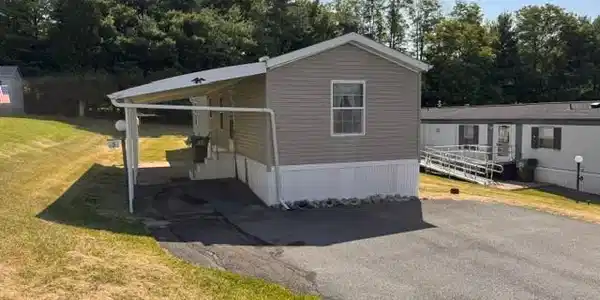 Image 2: A well-maintained manufactured home with a practic