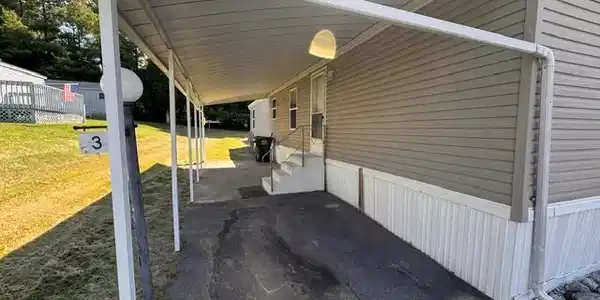 Image 3: A sheltered entryway leads to this home, offering