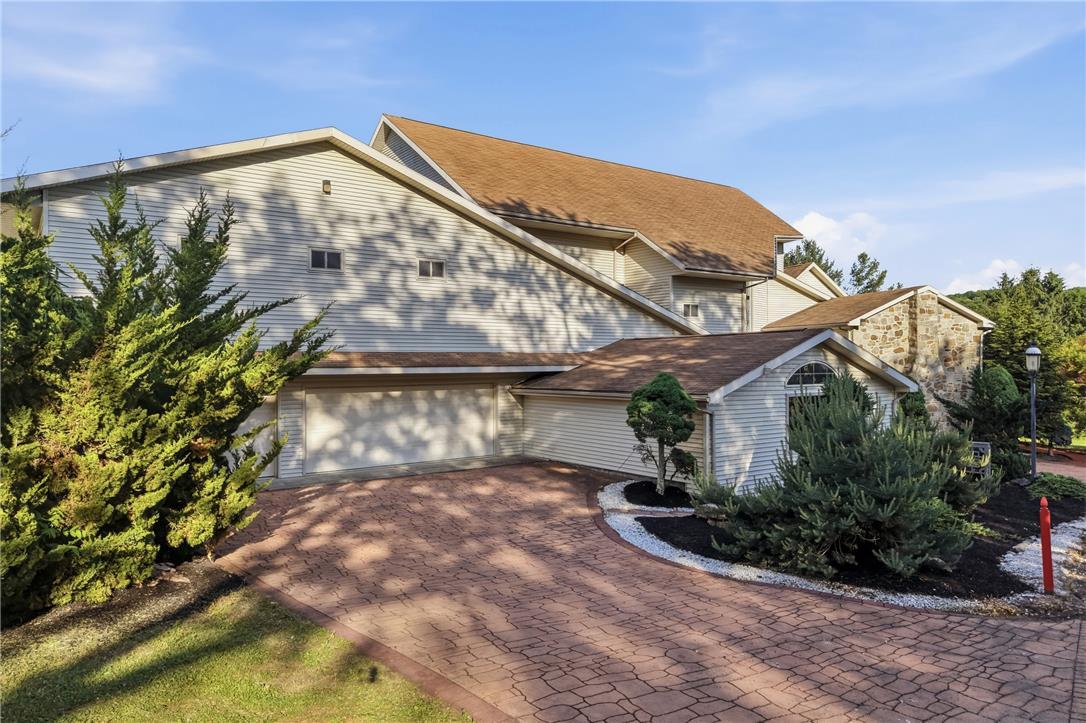Image 4: A gracefully winding driveway leads to this reside