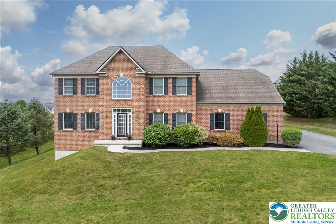 Image 2: A classic brick exterior with prominent architectu
