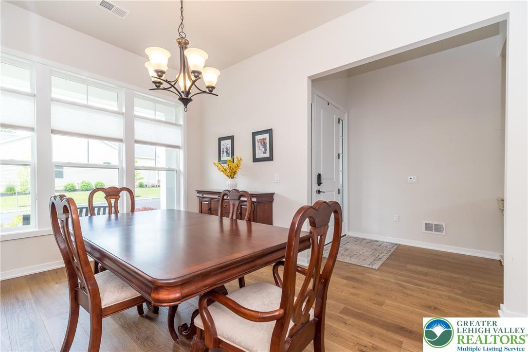 Image 4: Gather with family and friends in the dining room
