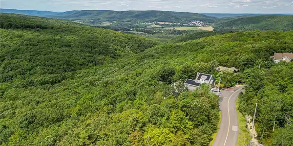 Image 2: Nestled among hills, a secluded residence offers t