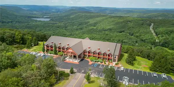 Image 3: Perched on a mountaintop, this expansive lodge ove