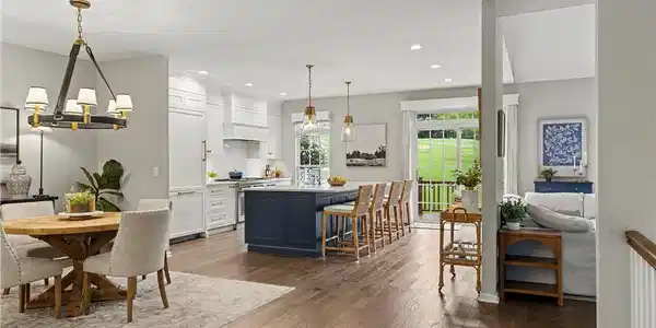 Image 3: Gleaming hardwood floors and a spacious kitchen is