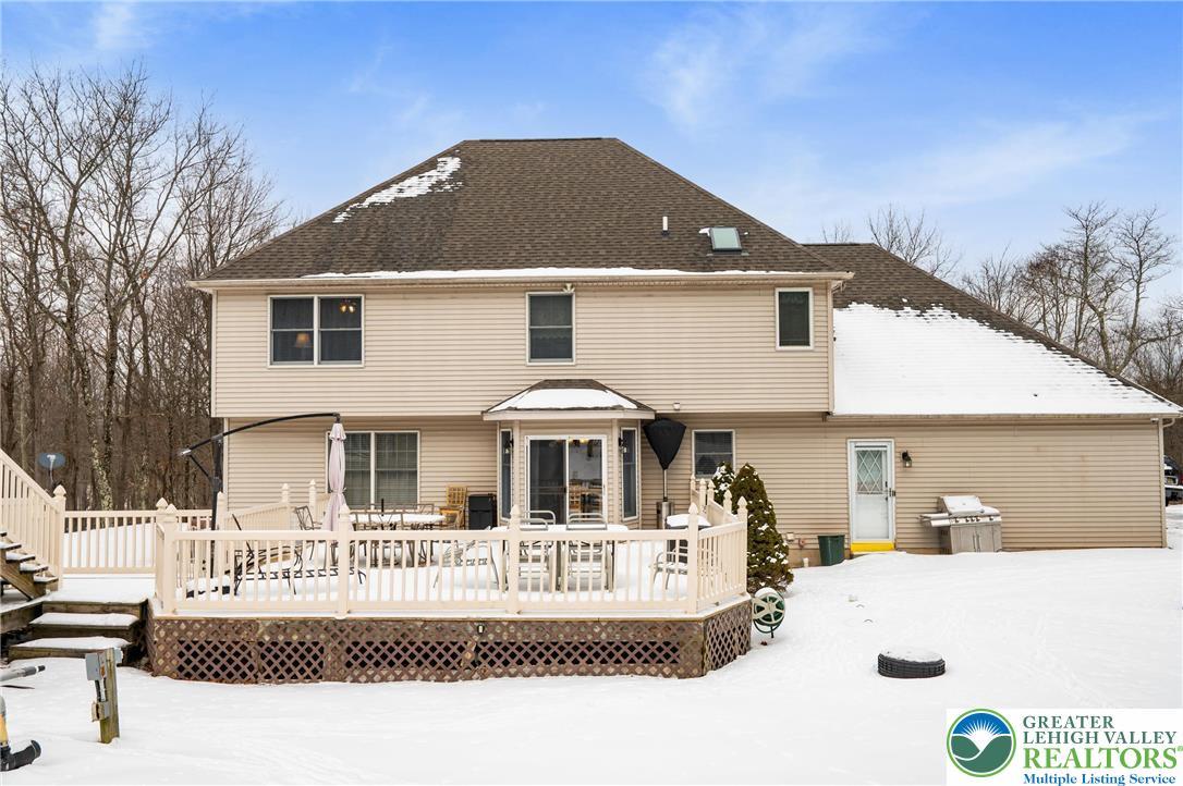 Image 3: One of two decks.  Slider on the kitchen eating ar