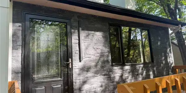 Image 3: Bold stone cladding adds character to this welcomi