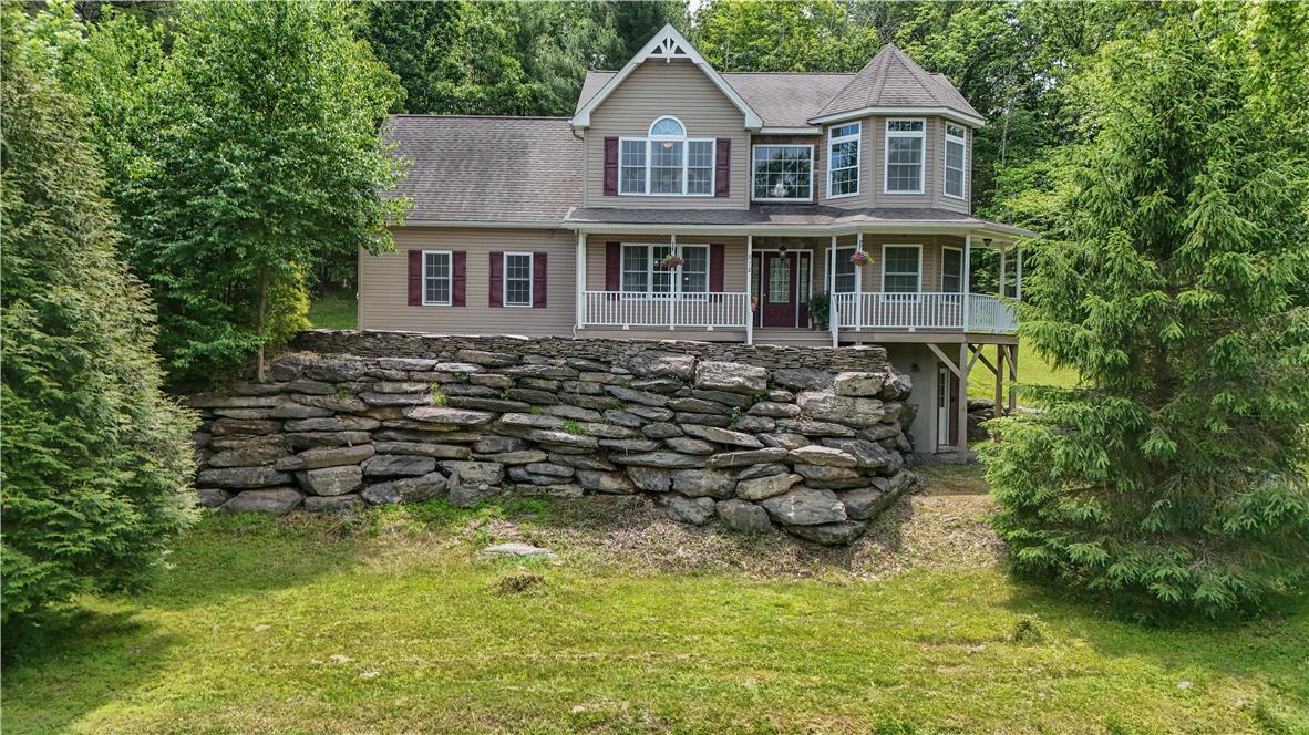 Image 3: A classic facade with a charming porch overlooking