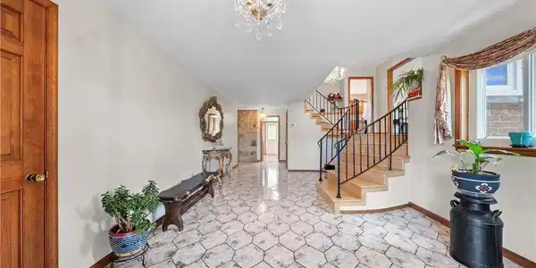 Image 2: A graceful staircase with wrought iron railings hi