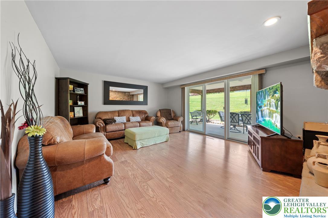 Image 4: Hardwood flooring extends throughout this generous