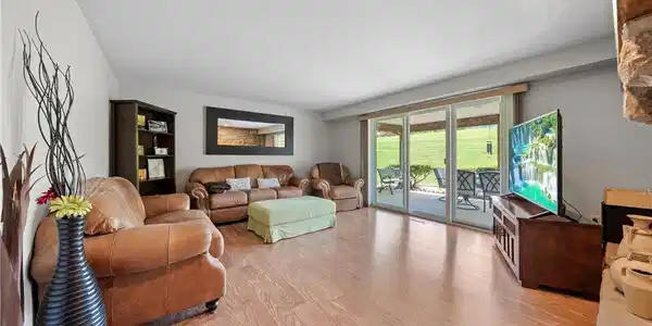 Image 4: Hardwood flooring extends throughout this generous