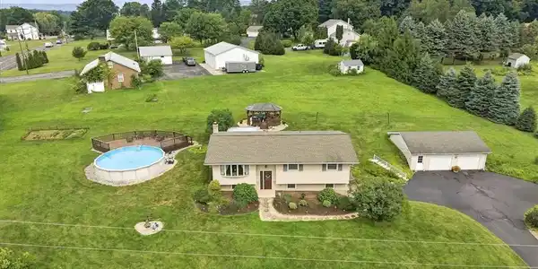 Image 2: An aerial perspective reveals a charming residence