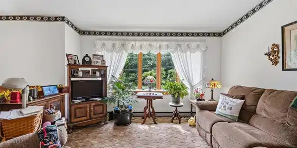 Image 4: A welcoming living area offers ample natural light