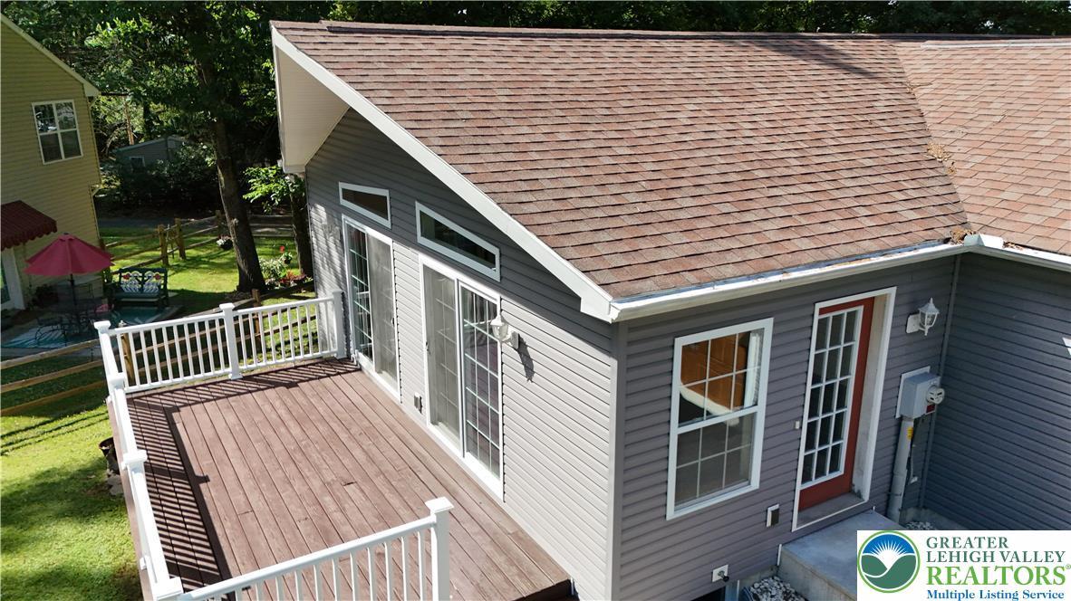 Image 4: Step out onto this spacious wooden deck, perfect f
