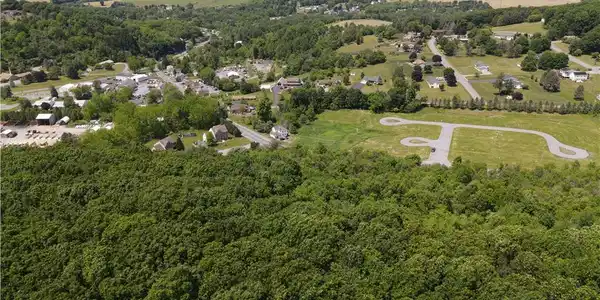 Image 2: An aerial perspective reveals a verdant landscape